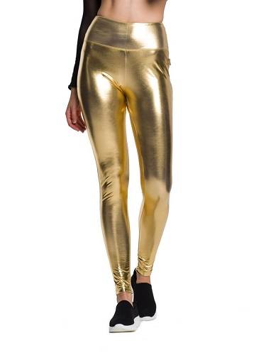 Women's metallic shiny leggings with long legs and high-waisted for a golden performance.